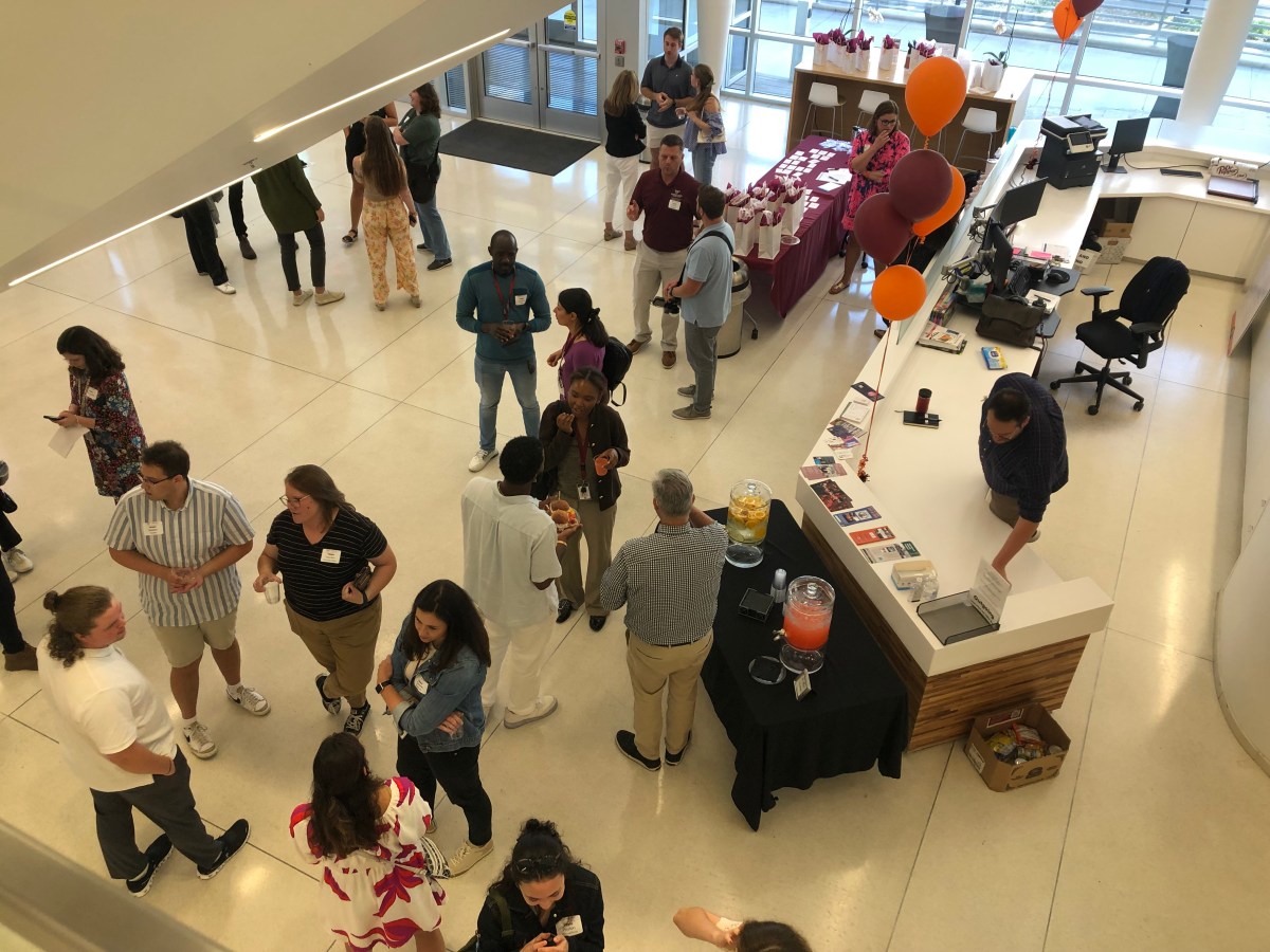 As seen from a second-floor mezzanine, alumni, students, professors and administrators gather Friday at Fralin Biomedical Research Institute at VTC to celebrate 10 years of the Translational Biology, Medicine and Health program.