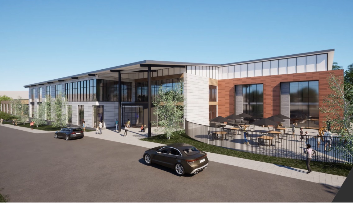 A rendering of a new Martinsville YMCA building, with a wall of windows and outdoor seating area